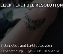 bird tattoo on wrist girl