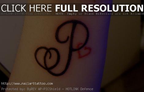 black heart tattoo arm